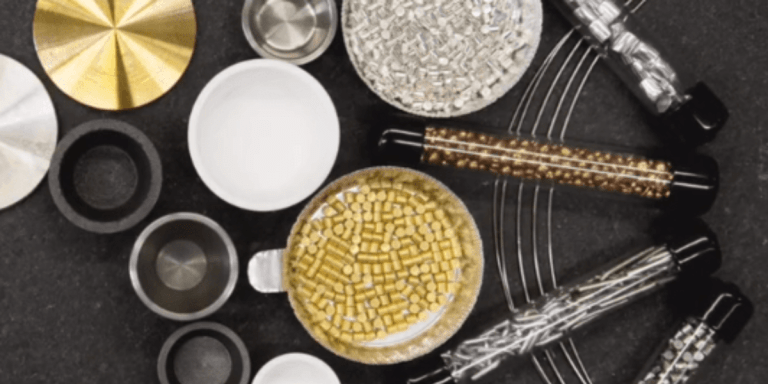 Display of different evaporation materials for physical vapor deposition, including sputtering targets, pellets, and e-beam liners